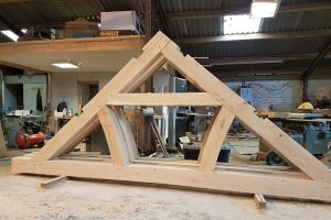 Boxed curve tied queen roof truss in douglas fir